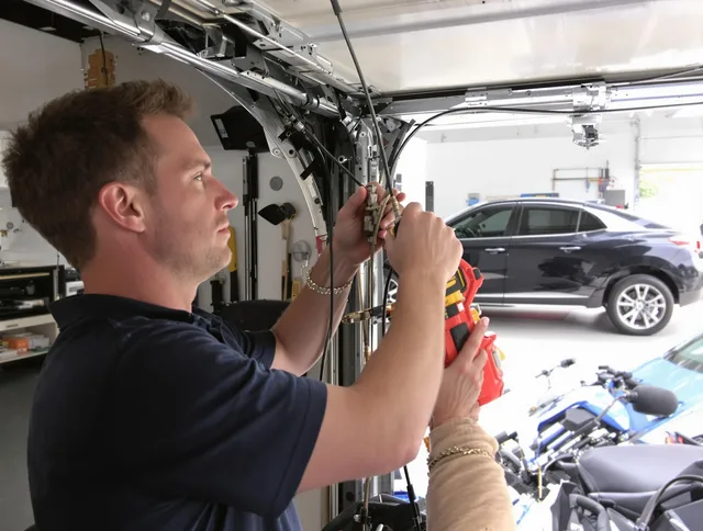 Cornelius Garage Door Repair safety certified technician performing cable replacement in Cornelius