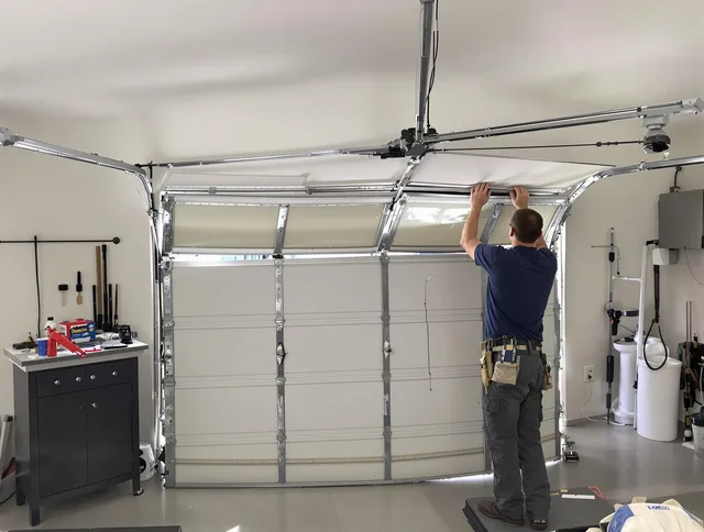Cornelius Garage Door Repair specialist performing precise section replacement on Cornelius garage door
